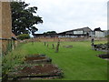 All Saints, Mollington:  looking towards a barn