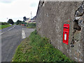 D0032 : Post box, Urbal Road Junction by Mick Garratt