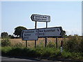TM0990 : Roadsigns on the B1113 The Turnpike by Geographer