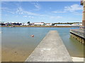 Looking along wall by slipway into the Adur