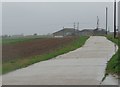 Sodden path to farm buildings