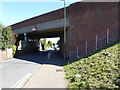 Looking eastwards on Freshbrook Road under Grinstead Lane