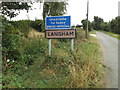 TL9770 : Langham Village Name sign on Stock Hill by Geographer