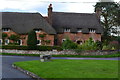 Thatched cottages by the green at Beauworth