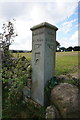 Way marker stone near Ing Head