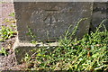 Benchmark on gatepost at entrance to Thornton Watlass Hall