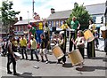 Percussion group and stilt walkers on Main Street, Castlewellan