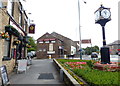 Clock and pub in Up Holland