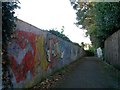 Tuckton: colourful graffiti alongside footpath I09