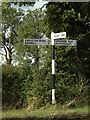 TM0995 : Signpost on Bunwell Road by Geographer