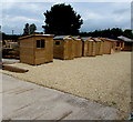 Variety of garden sheds on display in a Walford yard