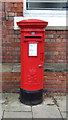 Elizabeth II postbox outside Hale Railway Station