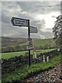 Signpost at the road junction in Ughill