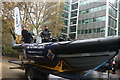 View of a Royal Navy dinghy on the back of a low loader in the Lord Mayor