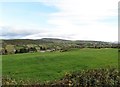 J1124 : View across pasture land towards the Grinan Trough by Eric Jones