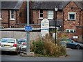 A pay & display car park on King Street and houses on Moorside