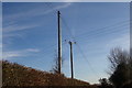 TG0823 : Electricity Poles on Kerdiston Road by Geographer