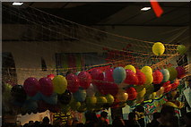 TQ2481 : View of balloons on a hammock in the Portobello Road Winter Festival by Robert Lamb