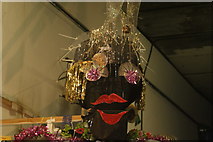 TQ2481 : View of a person made out of art materials in the Portobello Road Winter Festival #2 by Robert Lamb