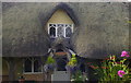 ST8082 : Thatched Cottage Window, Station Rd,  Badminton, Gloucestershire 2011 by Ray Bird