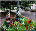 Victorian public artwork and flowerbed on a Street corner, Somerset