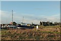 NU1241 : Beached boats and Lindisfarne Priory by Alan Murray-Rust