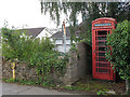 Phone box and broken road sign in Christow