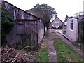 SZ1392 : West Southbourne: disused garage on footpath H14 by Chris Downer