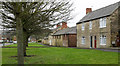 NZ3242 : Houses and farm in Sherburn by Trevor Littlewood