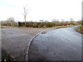 Junction of farm road with corner of Bramlands Lane