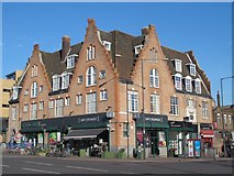 TQ3287 : Manor House and Simply Organique, Seven Sisters Road / Green Lanes, N4 by Mike Quinn