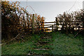 A stile on a short footpath across a small field