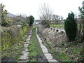 Queensbury FP27 on an old flagged cart track