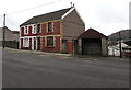 Semi-detached houses behind a Bridgend Road bus stop, Maesteg