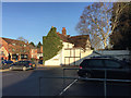 Extended timber-framed house next to Sainsbury