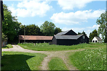 TL7123 : Barns at Pound Farm by Robin Webster
