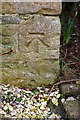 Benchmark on barn conversion house at NE end of Church Road