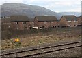 View from a Cardiff-Swansea train - housing on the edge of Margam