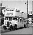 An open top bus passing Thorpe House on the B1016 Eastern Esplanade