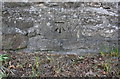 Cut mark on wall beside B6274 opposite Olliver Cottages