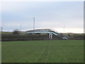 Path across field at High Brooks leading to M6 footbridge