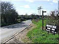 Footpath Sign And Road