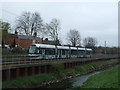 Northbound tram beside the River Leen