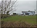 Bungalow by a road junction north of Llanerchymedd