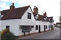 TL6408 : Weatherboarded Cottages in Roxwell by Glyn Baker
