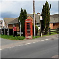 Phonebox, postbox and bus stop on a suburban corner of Lydney