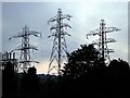 Electricity pylons at dusk. The Ridge grid station