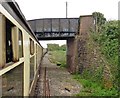 ST1827 : Train passing under Montys Lane by Roger Cornfoot