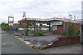 Disused Petrol Station and United Footwear Outlet on Carr Mill Road