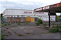 Disused Burmah Petrol Station and United Footwear Outlet on Carr Mill Road